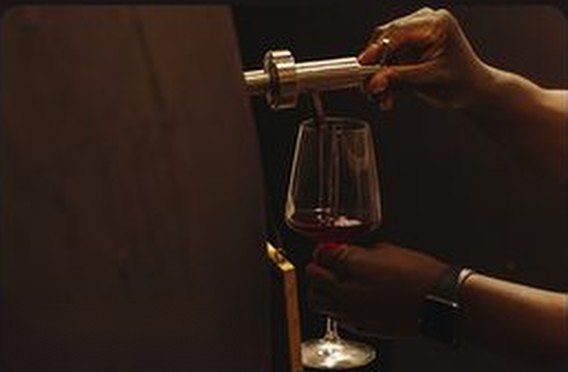 Wine poured through an aerator into a glass