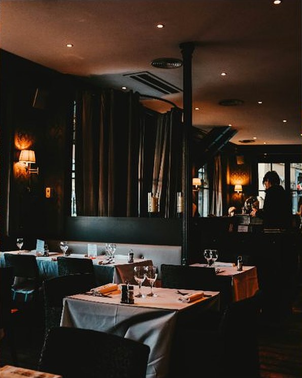 An intimate fine dining room with set tables